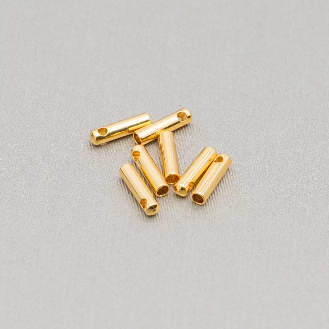 Capocorda Di Acciaio Interno 1,2mm Esterno 1,8x7,0mm Placcato Oro 200pz-CAPOCORDA | Worldofjewel.com