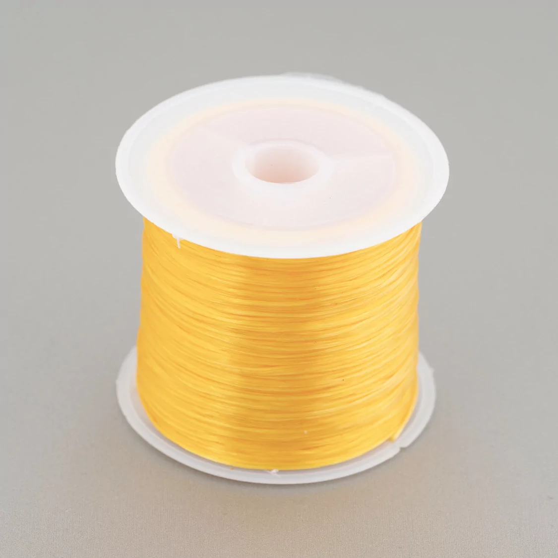 Filo di Elastico Multifilo Misura 0,5mm 30 Metri 1 Bobina Arancio Chiaro-FILO di ELASTICO | Worldofjewel.com