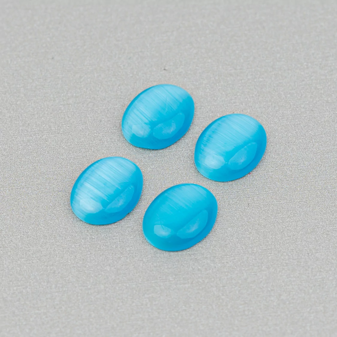 Cabochon Di Occhio Di Gatto Incastonati Ovale 8x10mm 40pz Azzurro- CABOCHON DI CRISTALLI | Worldofjewel.com