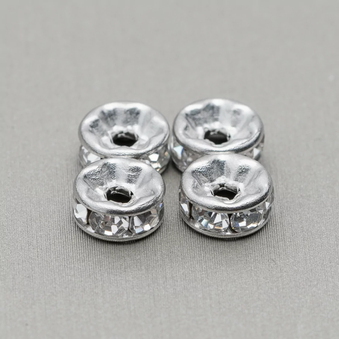 Distanziatore Rondelle Strass Di Acciaio 4mm 100pz-CONNETTORI CON STRASS | Worldofjewel.com