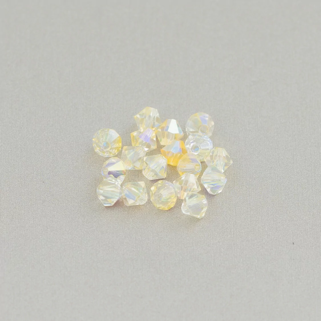 Cristalli Swarovski Bicono 4mm Marca Preciosa - 100pz - Giallo Chiaro AB-CRISTALLI SWAROVSKI | Worldofjewel.com